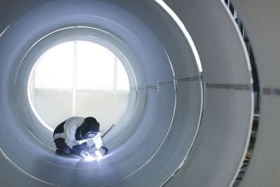 Figure 5. Figure 5. A Linde worker welds a stainless steel vessel.