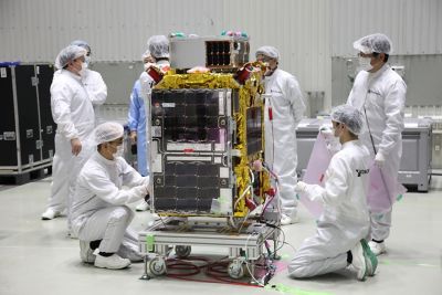 Scientists working in a lab on a satellite