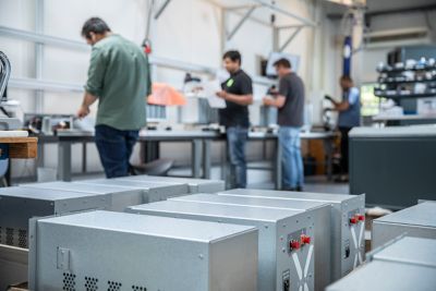 Workers assembling battery sub-modules at LITHIUM BALANCE