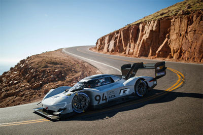 The Volkswagen I.D. R electric car drving down a mountain