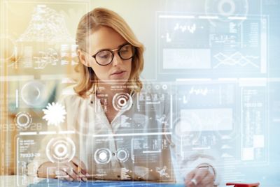 Woman working at a futuristic computer