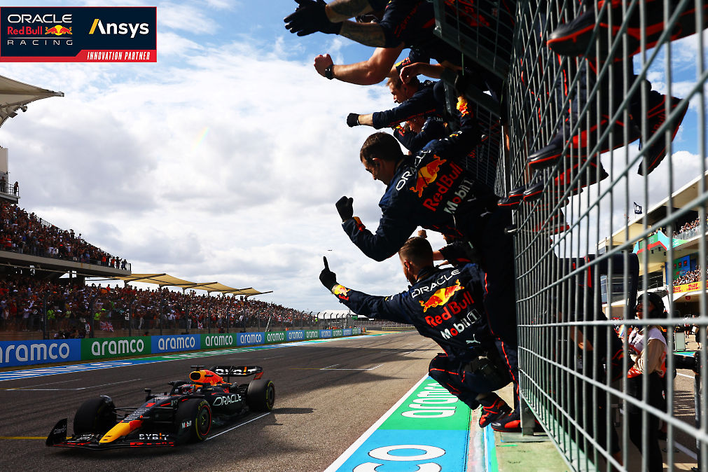 Race winner Max Verstappen of the Netherlands and Oracle Red Bull Racing crosses the finish line as team members celebrate