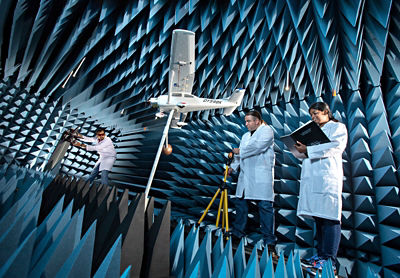 Penn State professor and students in anechoic chamber