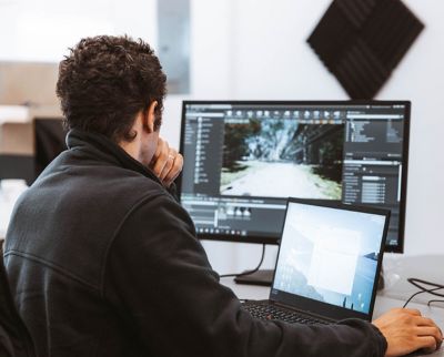 man sitting at a computer