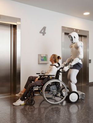 Robot pushing wheelchair