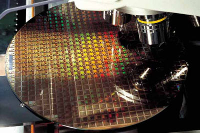 A silicon wafer being inspected at a TSMC semiconductor fabrication plant