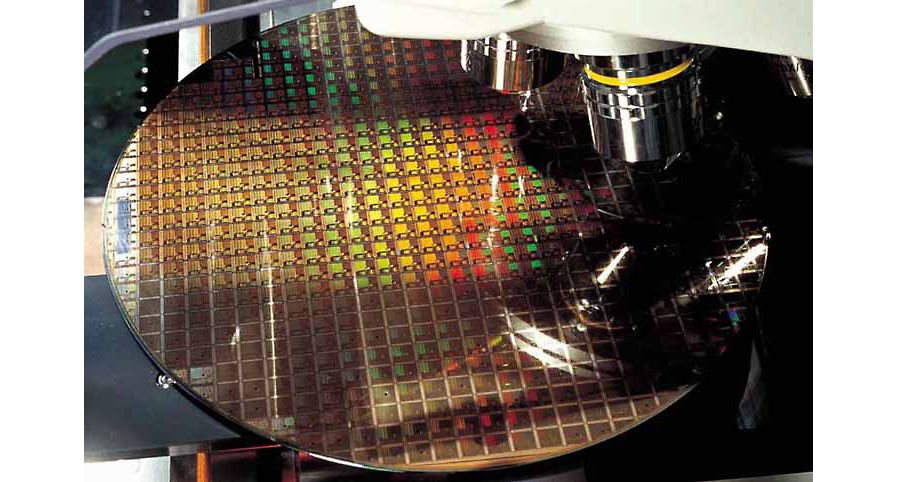 A silicon wafer being inspected at a TSMC semiconductor fabrication plant