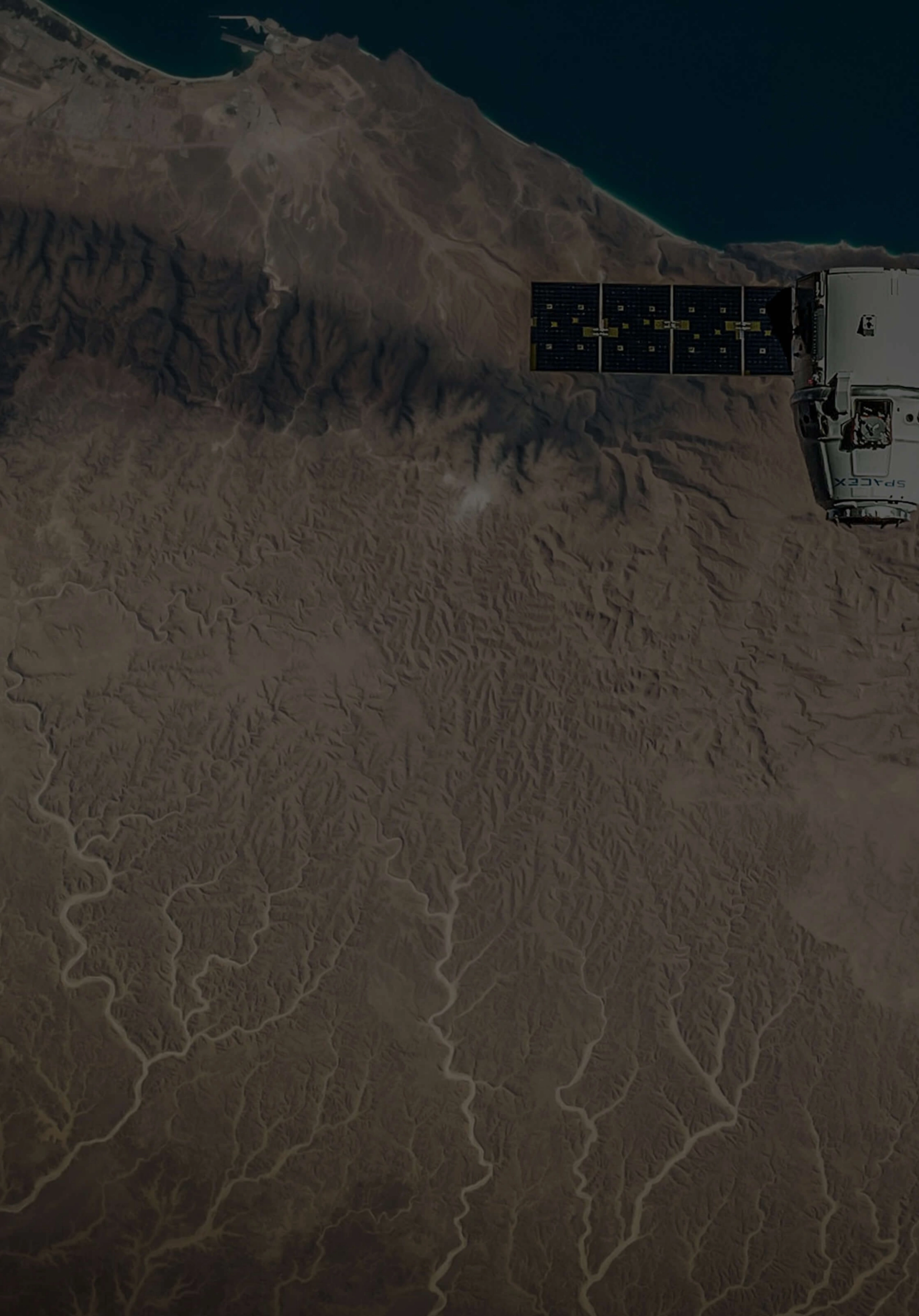 Background image of satellite orbiting over desert landscape